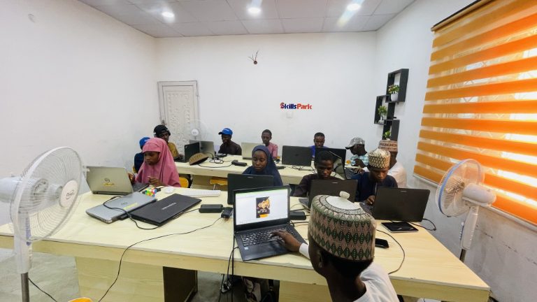SkillsPark learners creating practical graphic design work during a final project session.