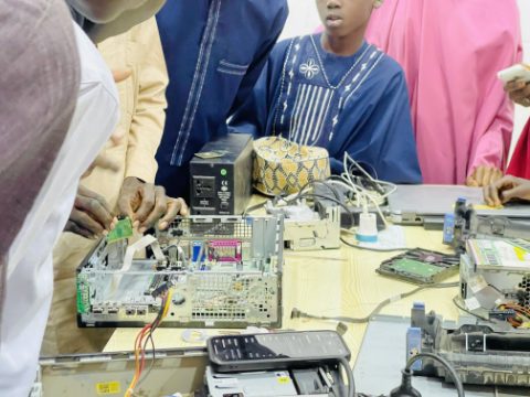 SkillsPark learners interacting with tools and asking questions during training.